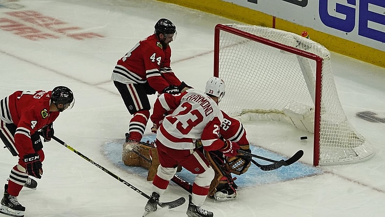 Oct 24, 2021; Chicago, Illinois, USA; Detroit Red Wings right wing Lucas Raymond (23)  scores a goal against the Chicago Blackhawks during the first period at United Center. Mandatory Credit: David Banks-USA TODAY Sports