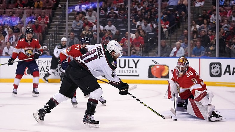 Oct 25, 2021; Sunrise, Florida, USA; Florida Panthers goaltender Spencer Knight (30) blocks the shot of Arizona Coyotes right wing Phil Kessel (81) during the first period at FLA Live Arena. Mandatory Credit: Jasen Vinlove-USA TODAY Sports