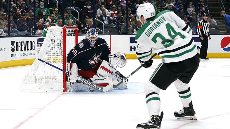 Oct 25, 2021; Columbus, Ohio, USA; Columbus Blue Jackets goalie Elvis Merzlikins (90) tracks the shot from Dallas Stars right wing Denis Gurianov (34) during the first period at Nationwide Arena. Mandatory Credit: Russell LaBounty-USA TODAY Sports