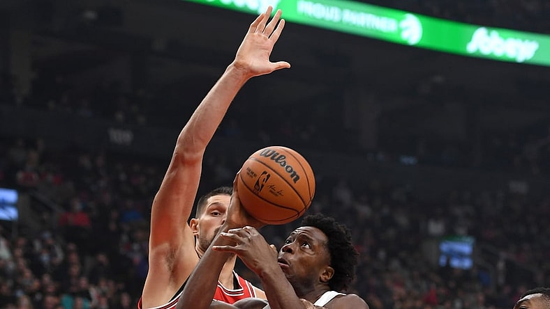 Oct 25, 2021; Toronto, Ontario, CAN; Toronto Raptors forward OG Anunoby (center) has a shot blocked by Chicago Bulls center Nikola Vucevic (9) in the first half at Scotiabank Arena. Mandatory Credit: Dan Hamilton-USA TODAY Sports
