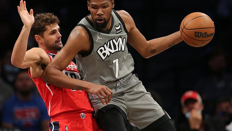 Oct 25, 2021; Brooklyn, New York, USA; Brooklyn Nets forward Kevin Durant (7) controls the ball against Washington Wizards guard Raul Neto (19) during the first quarter at Barclays Center. Mandatory Credit: Brad Penner-USA TODAY Sports