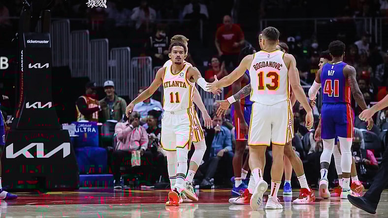 Oct 25, 2021; Atlanta, Georgia, USA;  Atlanta Hawks guard Trae Young (11) high fives guard Bogdan Bogdanovic (13) during the first quarter against the Detroit Pistons at State Farm Arena. Mandatory Credit: Jacob Gonzalez-USA TODAY Sports