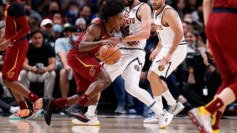 Oct 25, 2021; Denver, Colorado, USA; Cleveland Cavaliers guard Collin Sexton (2) dribbles the ball as Denver Nuggets guard Austin Rivers (25) defends in the second quarter at Ball Arena. Mandatory Credit: Isaiah J. Downing-USA TODAY Sports