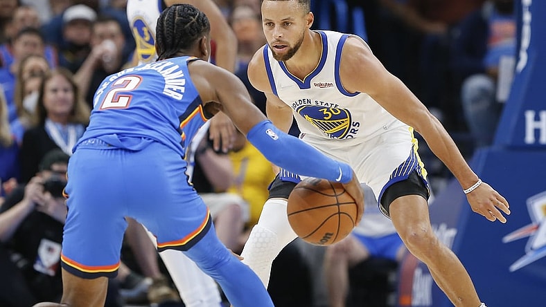 Oct 26, 2021; Oklahoma City, Oklahoma, USA; Golden State Warriors guard Stephen Curry (30) defends Oklahoma City Thunder guard Shai Gilgeous-Alexander (2) on a play during the first quarter at Paycom Center. Mandatory Credit: Alonzo Adams-USA TODAY Sports