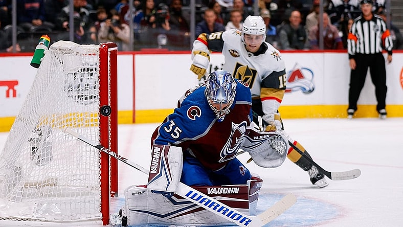 Oct 26, 2021; Denver, Colorado, USA; Colorado Avalanche goaltender Darcy Kuemper (35) deflects the puck ahead of Vegas Golden Knights center Jake Leschyshyn (15) in the first period at Ball Arena. Mandatory Credit: Isaiah J. Downing-USA TODAY Sports