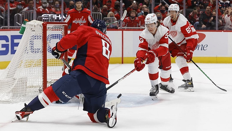 Oct 27, 2021; Washington, District of Columbia, USA; Washington Capitals left wing Alex Ovechkin (8) scores a goal on Detroit Red Wings goaltender Thomas Greiss (29) during the first period at Capital One Arena. Mandatory Credit: Geoff Burke-USA TODAY Sports