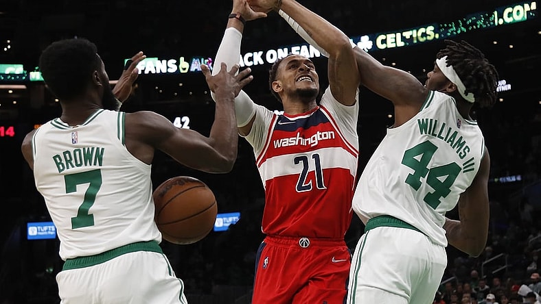 Oct 27, 2021; Boston, Massachusetts, USA; Boston Celtics center Robert Williams III (44) and guard Jaylen Brown (7) knock the ball away from Washington Wizards center Daniel Gafford (21) during the first quarter at TD Garden. Mandatory Credit: Winslow Townson-USA TODAY Sports