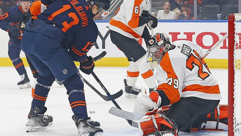 Oct 27, 2021; Edmonton, Alberta, CAN; Philadelphia Flyers goaltender Carter Hart (79) makes a save against Edmonton Oilers forward Jesse Puljujarvi (13) during the first period at Rogers Place. Mandatory Credit: Perry Nelson-USA TODAY Sports