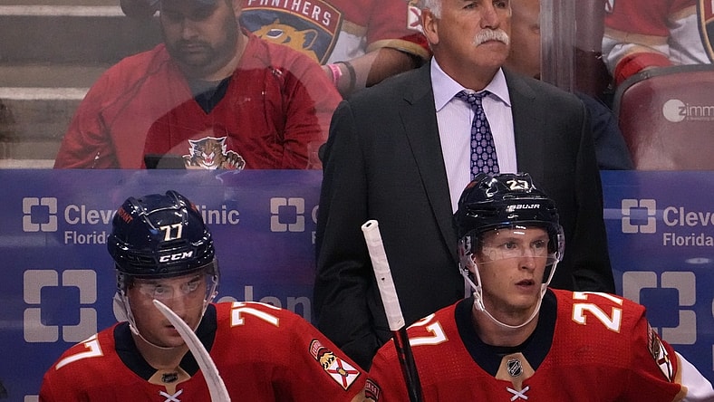 Oct 27, 2021; Sunrise, Florida, USA; Florida Panthers head coach Joel Quenneville watches from behind the bench during the first period between the Florida Panthers and the Boston Bruins at FLA Live Arena. Mandatory Credit: Jasen Vinlove-USA TODAY Sports