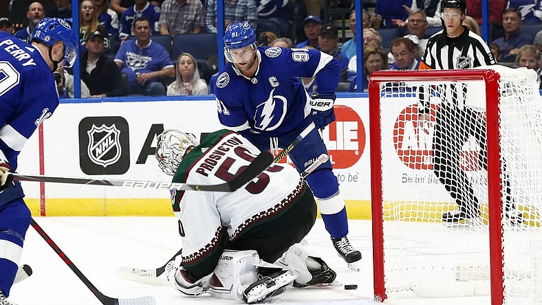 Oct 28, 2021; Tampa, Florida, USA;  Tampa Bay Lightning center Steven Stamkos (91) scores a goal on Arizona Coyotes goaltender Ivan Prosvetov (50) during the first period at Amalie Arena. Mandatory Credit: Kim Klement-USA TODAY Sports