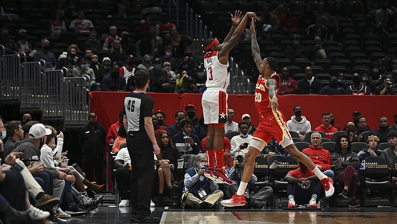 Oct 28, 2021; Washington, District of Columbia, USA;  Washington Wizards guard Bradley Beal (3) shoots over Atlanta Hawks forward John Collins (20) during the first half at Capital One Arena. Mandatory Credit: Tommy Gilligan-USA TODAY Sports
