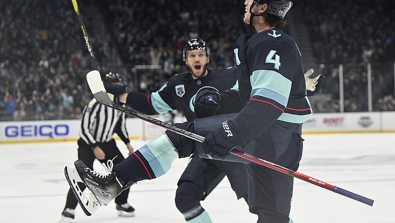 Oct 28, 2021; Seattle, Washington, USA; Seattle Kraken defenseman Haydn Fleury (4) celebrates after scoring a goal against the Minnesota Wild during the second period at Climate Pledge Arena. Mandatory Credit: Steven Bisig-USA TODAY Sports