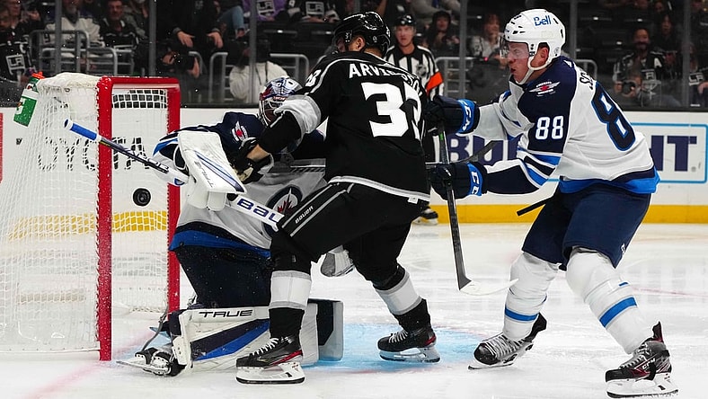 Oct 28, 2021; Los Angeles, California, USA; Winnipeg Jets goaltender Eric Comrie (1) and defenseman Nate Schmidt (88) defend the goal against LA Kings right wing Viktor Arvidsson (33) in the second period at Staples Center. Mandatory Credit: Kirby Lee-USA TODAY Sports