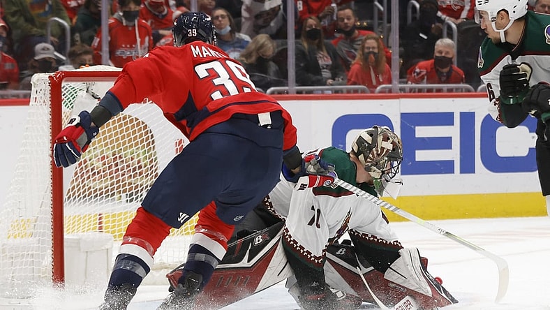 Oct 29, 2021; Washington, District of Columbia, USA; Arizona Coyotes goaltender Karel Vejmelka (70) makes a save on Washington Capitals right wing Anthony Mantha (39) during the first period at Capital One Arena. Mandatory Credit: Geoff Burke-USA TODAY Sports