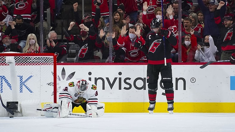 Oct 29, 2021; Raleigh, North Carolina, USA;  Carolina Hurricanes center Jordan Staal (11) celebrates his first period goal past Chicago Blackhawks goaltender Kevin Lankinen (32) at PNC Arena. Mandatory Credit: James Guillory-USA TODAY Sports