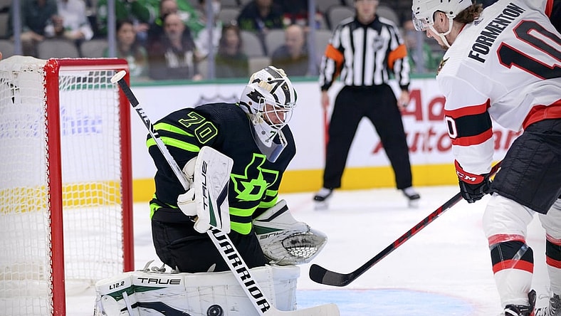 Oct 29, 2021; Dallas, Texas, USA; Dallas Stars goaltender Braden Holtby (70) stops a shot by Ottawa Senators left wing Alex Formenton (10) during the first period at the American Airlines Center. Mandatory Credit: Jerome Miron-USA TODAY Sports