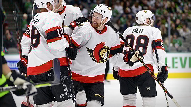 Oct 29, 2021; Dallas, Texas, USA; Ottawa Senators left wing Tim St tzle (18) and right wing Connor Brown (28) and defenseman Victor Mete (98) celebrates a goal scored by Brown against the Dallas Stars during the third period at the American Airlines Center. Mandatory Credit: Jerome Miron-USA TODAY Sports