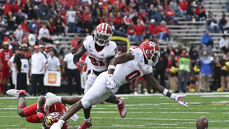 Oct 30, 2021; College Park, Maryland, USA;  Indiana Hoosiers quarterback Donaven McCulley (0) reaches for a tipped ball during the first half against the Maryland Terrapins at Capital One Field at Maryland Stadium. Mandatory Credit: Tommy Gilligan-USA TODAY Sports