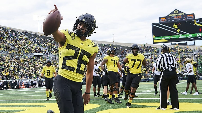 Oct 30, 2021; Eugene, Oregon, USA; Oregon Ducks running back Travis Dye (26) celebrates after scoring a touchdown during the first half against the Colorado Buffaloes at Autzen Stadium. Mandatory Credit: Troy Wayrynen-USA TODAY Sports