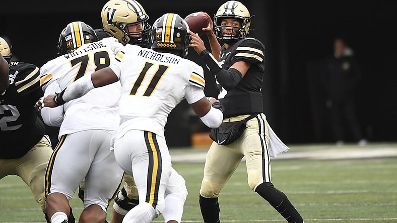 Oct 30, 2021; Nashville, Tennessee, USA; Vanderbilt Commodores quarterback Mike Wright (5) attempts a pass during the first half against the Missouri Tigers at Vanderbilt Stadium. Mandatory Credit: Christopher Hanewinckel-USA TODAY Sports
