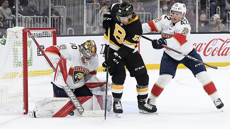 Oct 30, 2021; Boston, Massachusetts, USA;  Florida Panthers goaltender Spencer Knight (30) makes a save in front of Boston Bruins left wing Erik Haula (56) and defenseman Gustav Forsling (42) during the first period at TD Garden. Mandatory Credit: Bob DeChiara-USA TODAY Sports