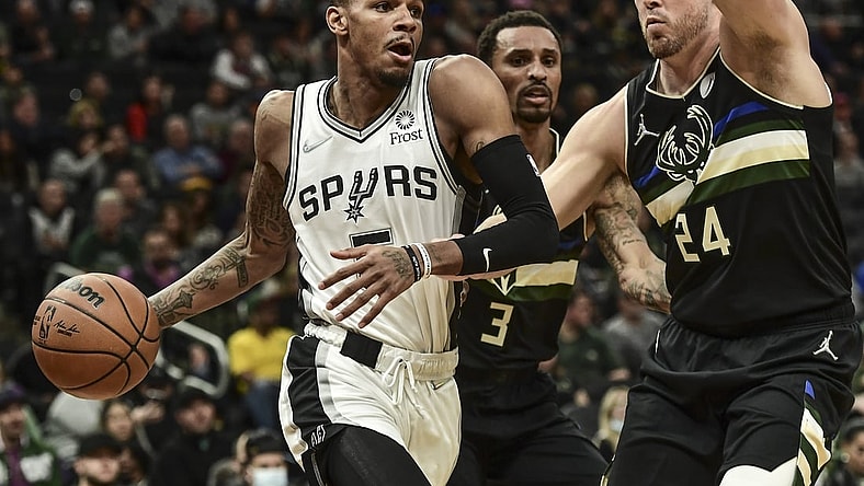 Oct 30, 2021; Milwaukee, Wisconsin, USA; San Antonio Spurs guard Dejounte Murray (5) drives to the basket against Milwaukee Bucks guard Pat Connaughton (24) in the first quarter at Fiserv Forum. Mandatory Credit: Benny Sieu-USA TODAY Sports