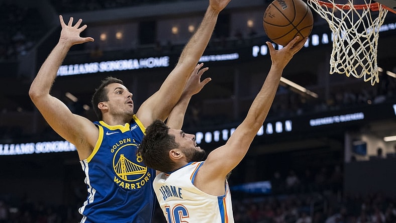 October 30, 2021; San Francisco, California, USA; Oklahoma City Thunder guard Ty Jerome (16) shoots the basketball against Golden State Warriors forward Nemanja Bjelica (8) during the first quarter at Chase Center. Mandatory Credit: Kyle Terada-USA TODAY Sports