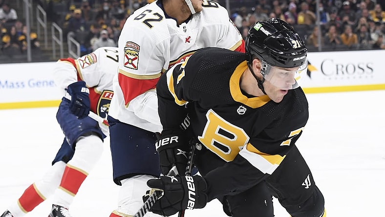 Oct 30, 2021; Boston, Massachusetts, USA;  Florida Panthers defenseman Brandon Montour (62) and Boston Bruins left wing Taylor Hall (71) battle during the first period at TD Garden. Mandatory Credit: Bob DeChiara-USA TODAY Sports