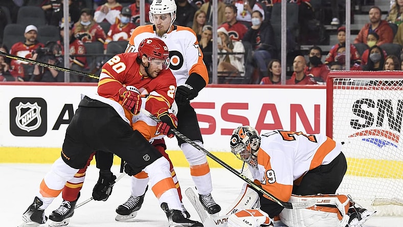 Oct 30, 2021; Calgary, Alberta, CAN; Philadelphia Flyers goalie Carter Hart (79) stops a shot against Calgary Flames forward Blake Coleman (20) during the first period at Scotiabank Saddledome. Mandatory Credit: Candice Ward-USA TODAY Sports