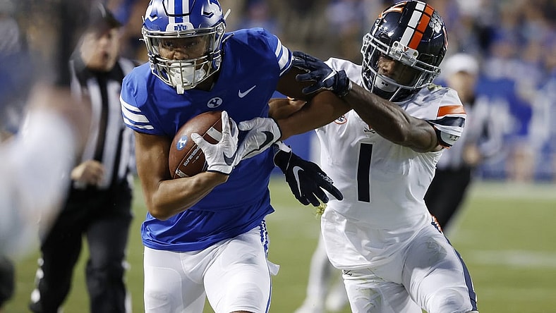Oct 30, 2021; Provo, Utah, USA; Brigham Young Cougars wide receiver Keanu Hill (1) is pushed out of bounds after a reception by Virginia Cavaliers cornerback Nick Grant (1) in the first quarter  at LaVell Edwards Stadium. Mandatory Credit: Jeffrey Swinger-USA TODAY Sports