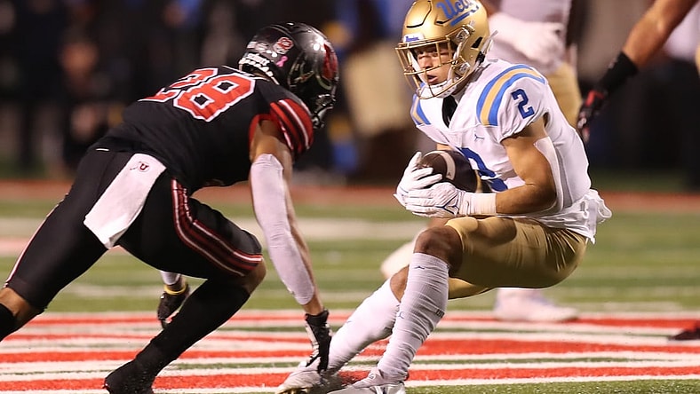 Oct 30, 2021; Salt Lake City, Utah, USA;  UCLA Bruins wide receiver Kyle Philips (2) is tackled by Utah Utes safety Brandon McKinney (28) during the first quarter at Rice-Eccles Stadium. Mandatory Credit: Rob Gray-USA TODAY Sports