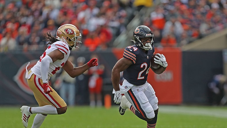 Oct 31, 2021; Chicago, Illinois, USA; Chicago Bears running back Khalil Herbert (24) runs past San Francisco 49ers cornerback Josh Norman (26) during the first half at Soldier Field. Mandatory Credit: Dennis Wierzbicki-USA TODAY Sports