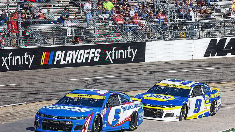 Oct 31, 2021; Martinsville, Virginia, USA; NASCAR Cup Series driver Kyle Larson (5) leads races Chase Elliott (9) at the 73rd Annual Xfinity 500 at Martinsville Speedway. Mandatory Credit: Ryan Hunt-USA TODAY Sports