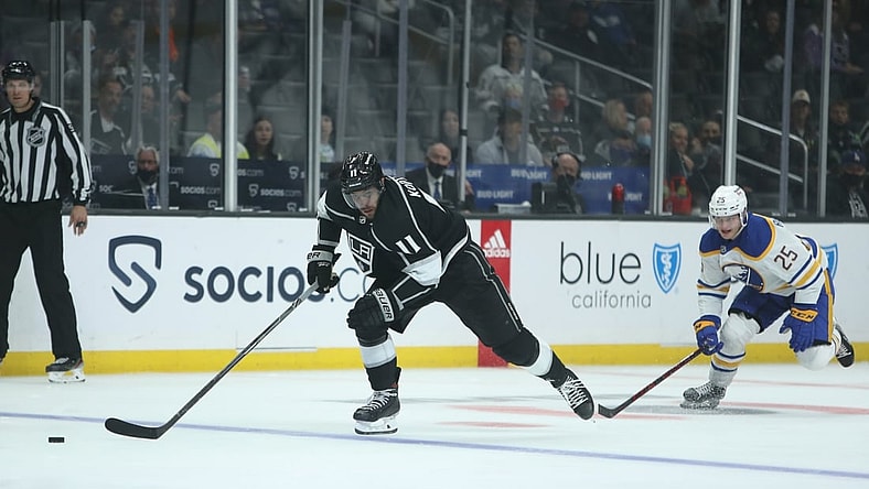 Oct 31, 2021; Los Angeles, California, USA; Los Angeles Kings center Anze Kopitar (11) chases the puck against Buffalo Sabres center Arttu Ruotsalainen (25) during the second period at Staples Center. Mandatory Credit: Kiyoshi Mio-USA TODAY Sports