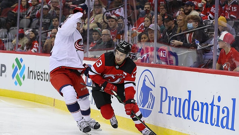 Oct 31, 2021; Newark, New Jersey, USA; New Jersey Devils center Nico Hischier (13) skates with the puck against the Columbus Blue Jackets during the second period at Prudential Center. Mandatory Credit: Ed Mulholland-USA TODAY Sports