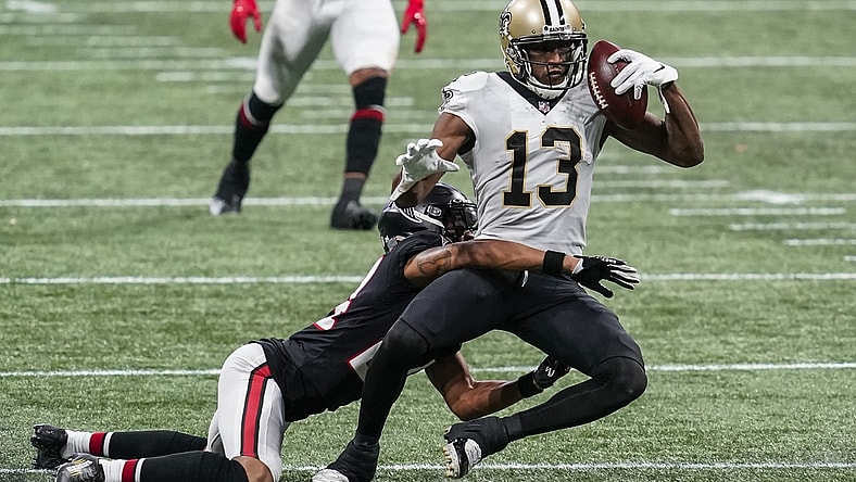 Dec 6, 2020; Atlanta, Georgia, USA; New Orleans Saints wide receiver Michael Thomas (13) holds on to the ball while being tackled by Atlanta Falcons cornerback A.J. Terrell (24)  during the second half at Mercedes-Benz Stadium. Mandatory Credit: Dale Zanine-USA TODAY Sports