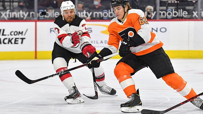 May 10, 2021; Philadelphia, Pennsylvania, USA; Philadelphia Flyers right wing Nicolas Aube-Kubel (62) moves around New Jersey Devils defenseman Matt Tennyson (7) during the first period at Wells Fargo Center. Mandatory Credit: Eric Hartline-USA TODAY Sports