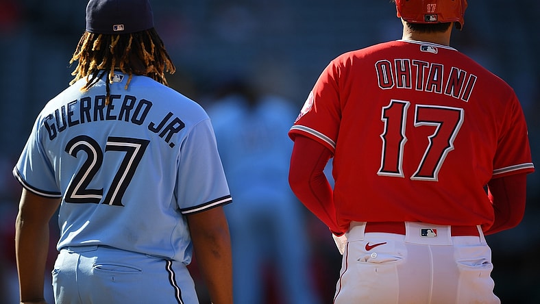 Aug 10, 2021; Anaheim, California, USA;  Toronto Blue Jays first baseman Vladimir Guerrero Jr. (27) and Los Angeles Angels designated hitter Shohei Ohtani (17) stand at first base in the sixth inning at Angel Stadium. Mandatory Credit: Jayne Kamin-Oncea-USA TODAY Sports