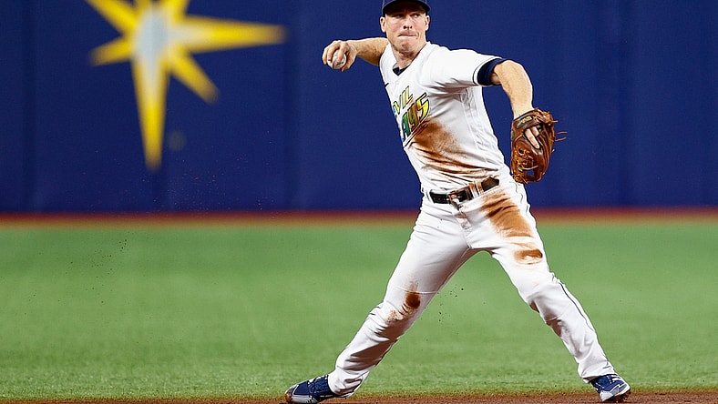 Sep 25, 2021; St. Petersburg, Florida, USA;  Tampa Bay Rays shortstop Joey Wendle (18) throws to first for an out in the first inning against the Miami Marlins at Tropicana Field. Mandatory Credit: Nathan Ray Seebeck-USA TODAY Sports