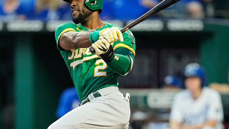 Sep 14, 2021; Kansas City, Missouri, USA; Oakland Athletics center fielder Starling Marte (2) hits a double against the Kansas City Royals during the first inning at Kauffman Stadium. Mandatory Credit: Jay Biggerstaff-USA TODAY Sports