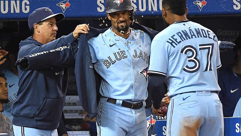 Oct 3, 2021; Toronto, Ontario, CAN;  Toronto Blue Jays second baseman Marcus Semien (10) celebrates with manager Charlie Montoyo (left) and left fielder Teoscar Hernandez (37) after hitting a solo home run against the Baltimore Orioles in the fifth inning at Rogers Centre. Mandatory Credit: Dan Hamilton-USA TODAY Sports
