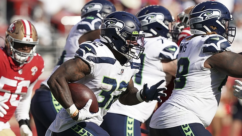 Oct 3, 2021; Santa Clara, California, USA; Seattle Seahawks running back Chris Carson (32) rushes during the fourth quarter against the San Francisco 49ers at Levi's Stadium. Mandatory Credit: Darren Yamashita-USA TODAY Sports