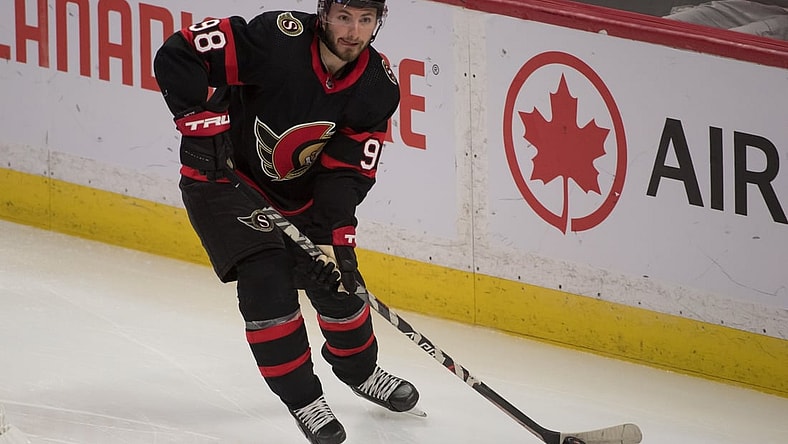 Oct 4, 2021; Ottawa, Ontario, CAN; Ottawa Senators defenseman Victor Mete (98) skates with the puck in the third period against the Toronto Maple Leafs  at the Canadian Tire Centre. Mandatory Credit: Marc DesRosiers-USA TODAY Sports