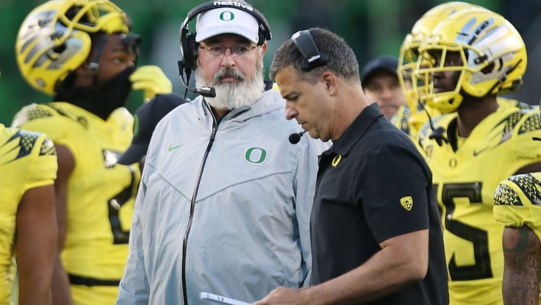 Oregon offensive coordinator Joe Moorhead, left, and head coach Mario Cristobal, on the sidelines during the game against Stony Brook.

Eug 101421 Moorhead05