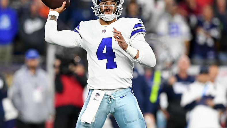 Oct 17, 2021; Foxborough, Massachusetts, USA; Dallas Cowboys quarterback Dak Prescott (4) passes the ball against the New England Patriots during the second half at Gillette Stadium. Mandatory Credit: Brian Fluharty-USA TODAY Sports