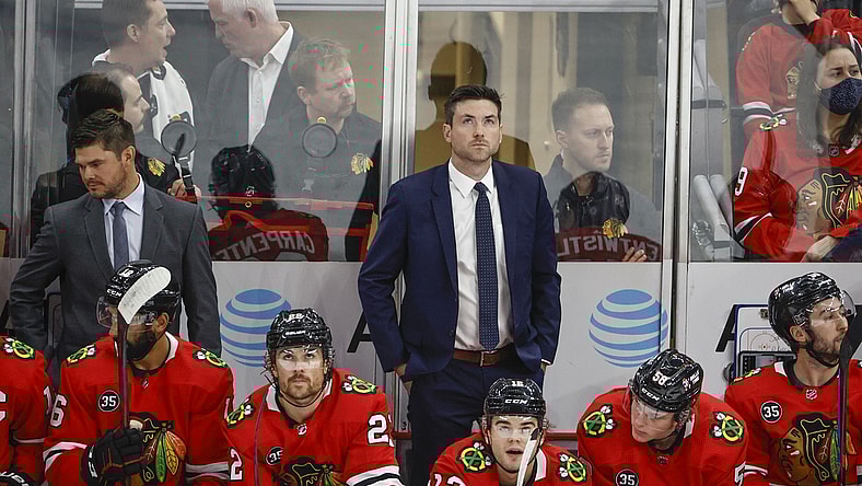 Oct 21, 2021; Chicago, Illinois, USA; Chicago Blackhawks head coach Jeremy Colliton looks on from the bench during the first period of a NHL game against the Vancouver Canucks at United Center. Mandatory Credit: Kamil Krzaczynski-USA TODAY Sports