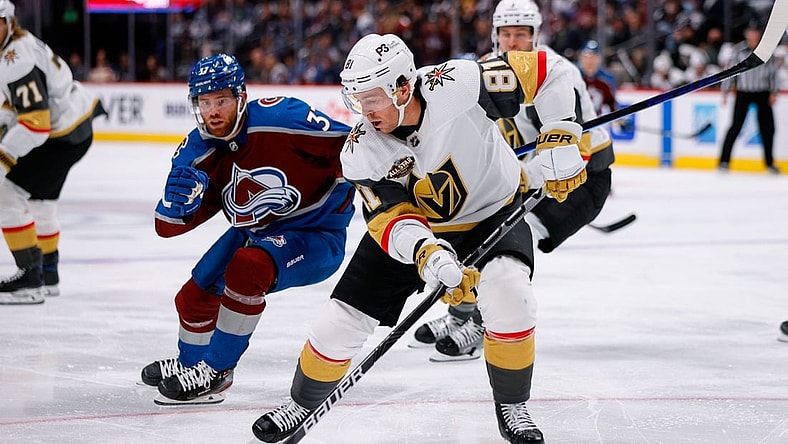 Oct 26, 2021; Denver, Colorado, USA; Vegas Golden Knights center Jonathan Marchessault (81) controls the puck ahead of Colorado Avalanche left wing J.T. Compher (37) in the second period at Ball Arena. Mandatory Credit: Isaiah J. Downing-USA TODAY Sports