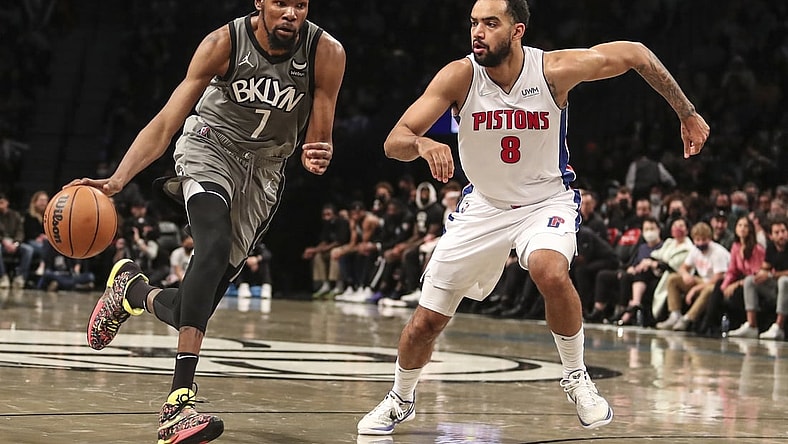 Oct 31, 2021; Brooklyn, New York, USA;  Brooklyn Nets forward Kevin Durant (7) drives past Detroit Pistons forward Trey Lyles (8) in the third quarter at Barclays Center. Mandatory Credit: Wendell Cruz-USA TODAY Sports