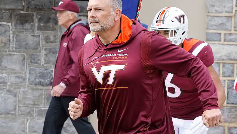 Oct 16, 2021; Blacksburg, Virginia, USA;  Virginia Tech Hokies head coach Justin Fuente leads his team onto the field before the game against the Pittsburgh Panthers at Lane Stadium. Mandatory Credit: Reinhold Matay-USA TODAY Sports