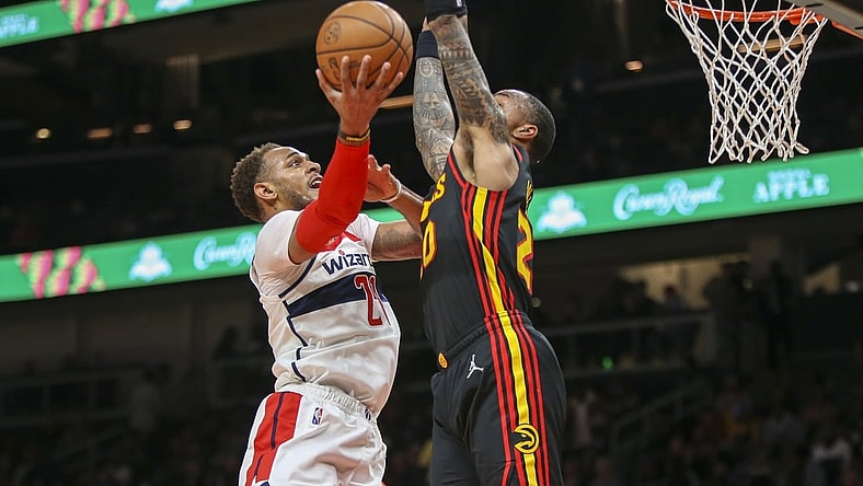 Nov 1, 2021; Atlanta, Georgia, USA; Washington Wizards center Daniel Gafford (21) shoots past Atlanta Hawks forward John Collins (20) in the first quarter at State Farm Arena. Mandatory Credit: Brett Davis-USA TODAY Sports